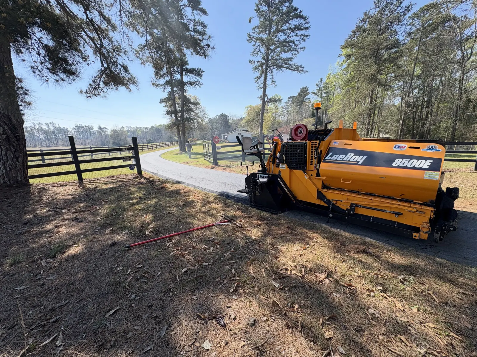 LeeBoy 8500E paver laying fresh asphalt on a driveway